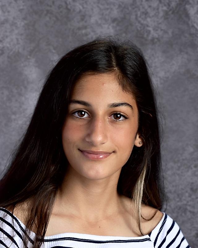 Yearbook portrait of 8th grade girl in striped shirt.